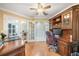 The home office features hardwood floors, crown moulding and French doors at 423 Fan Palm Ne Ct, St Petersburg, FL 33703