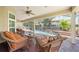 Inviting screened-in patio overlooking the pool and lush landscaping; perfect for relaxing and entertaining at 423 Fan Palm Ne Ct, St Petersburg, FL 33703