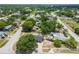 Aerial view of the home nestled in a serene neighborhood with tree-lined streets and well-kept properties at 4608 Deltona Blvd, Spring Hill, FL 34606