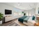 Bedroom featuring wood-style floors, a ceiling fan, and access to the outdoors at 4608 Deltona Blvd, Spring Hill, FL 34606