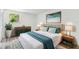 Cozy bedroom with stylish furnishings, including a plush bed, modern art, and leafy plant at 4608 Deltona Blvd, Spring Hill, FL 34606