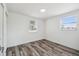Clean, bright bedroom with two windows and neutral walls at 4608 Deltona Blvd, Spring Hill, FL 34606
