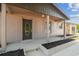 Inviting front porch with a decorative front door and freshly painted surface, adding a touch of style and charm at 4608 Deltona Blvd, Spring Hill, FL 34606