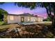 Charming single-story home featuring a unique stone accent wall and a well-maintained front yard, creating curb appeal at 4608 Deltona Blvd, Spring Hill, FL 34606