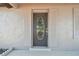 Unique front door with colorful stained glass detailing, adding character and charm to the home's entrance at 4608 Deltona Blvd, Spring Hill, FL 34606