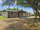 Charming home featuring stone accents, neutral siding, and a well-manicured front yard at 4608 Deltona Blvd, Spring Hill, FL 34606