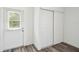 Hallway featuring a windowed door and sliding closet doors at 4608 Deltona Blvd, Spring Hill, FL 34606