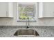 Bright kitchen sink and faucet with a view from the window at 4608 Deltona Blvd, Spring Hill, FL 34606