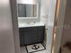 Bathroom featuring gray vanity with a view into the toilet and shower area at 51 Island Way # 309, Clearwater Beach, FL 33767