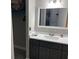 The bathroom features a mirror, sink, and cabinet at 51 Island Way # 309, Clearwater Beach, FL 33767