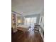 Cozy bedroom with built-in shelving, a Murphy bed, and a dining table at 51 Island Way # 309, Clearwater Beach, FL 33767