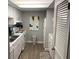 Well-lit kitchen featuring white cabinetry, modern appliances, and a practical layout at 51 Island Way # 309, Clearwater Beach, FL 33767