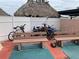This outdoor seating area includes benches and bike racks at 51 Island Way # 309, Clearwater Beach, FL 33767