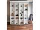 Built-in shelving unit adorned with plants, candles, and decorative objects, providing ample storage space at 51 Island Way # 309, Clearwater Beach, FL 33767