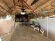 Tiki hut with granite bar, ceiling fan, TV, microwave, decorative surfboards and seating for dining at 51 Island Way # 309, Clearwater Beach, FL 33767