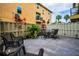 Private fenced-in backyard featuring tropical foliage and an outdoor dining set at 5529 White Marlin Ct, New Port Richey, FL 34652