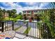 A balcony view of townhomes, with lush landscaping, and a street at 5529 White Marlin Ct, New Port Richey, FL 34652