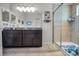 Bathroom featuring dual vanity, tile flooring and shower with glass door at 5529 White Marlin Ct, New Port Richey, FL 34652
