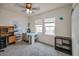 Well-lit bedroom featuring carpet floors, natural light, and a versatile layout ideal for a home office at 5529 White Marlin Ct, New Port Richey, FL 34652