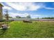 Large, fenced-in community dog park with benches and shade trees, offering a great space for pets to roam at 5529 White Marlin Ct, New Port Richey, FL 34652