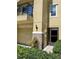 Two-story townhouse featuring a balcony, stone accents, and well-maintained landscaping at 5529 White Marlin Ct, New Port Richey, FL 34652