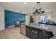 A view of kitchen island with granite countertops and stainless steel appliances adjacent to the dining area at 5529 White Marlin Ct, New Port Richey, FL 34652