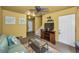 Living room area with a television, turtle-themed decor, and stairway access at 5529 White Marlin Ct, New Port Richey, FL 34652