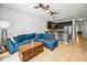 Open-concept living area featuring a sectional sofa, and kitchen with bar seating at 5529 White Marlin Ct, New Port Richey, FL 34652