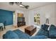 Bright living room with tile floors, modern decor, and balcony access at 5529 White Marlin Ct, New Port Richey, FL 34652