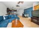 Open floor plan showcasing living room, dining area, and kitchen with stainless steel appliances at 5529 White Marlin Ct, New Port Richey, FL 34652
