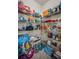 Spacious walk-in pantry providing ample storage with organized shelving for food and household items at 5529 White Marlin Ct, New Port Richey, FL 34652