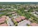 High angle view of condos featuring a lake, mature trees, and nearby community amenities at 5705 Baywater Dr # 5705, Tampa, FL 33615