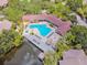 A luxurious community pool and pier are surrounded by lush landscaping and beautiful buildings at 5705 Baywater Dr # 5705, Tampa, FL 33615