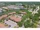 Aerial view showcasing a community with a lake, mature trees, and convenient parking at 5705 Baywater Dr # 5705, Tampa, FL 33615