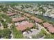 Expansive aerial view of a community with water access, lush trees, and ample parking at 5705 Baywater Dr # 5705, Tampa, FL 33615
