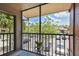 Relaxing balcony with views of lush trees and neighborhood parking at 5705 Baywater Dr # 5705, Tampa, FL 33615