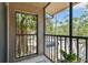 View from the balcony showcasing the surrounding landscaping and parking area at 5705 Baywater Dr # 5705, Tampa, FL 33615