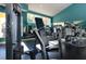 Modern gym showcasing weight machines, mirrors, and expansive windows overlooking a serene view at 5705 Baywater Dr # 5705, Tampa, FL 33615