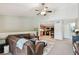 Open-concept living room leading to the kitchen, featuring a sectional sofa and vaulted ceilings at 5705 Baywater Dr # 5705, Tampa, FL 33615