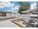 Backyard with patio area, storage, and air conditioning units at 6212 N Grady Ave, Tampa, FL 33614
