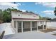 This backyard features a covered patio, concrete, and a house at 6212 N Grady Ave, Tampa, FL 33614