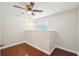 The bedroom features a window for natural light and beautiful hardwood floors at 6212 N Grady Ave, Tampa, FL 33614