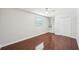 Bright bedroom boasts hardwood floors, built in shelving, and ample closet space at 6212 N Grady Ave, Tampa, FL 33614