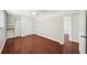 Bedroom features a closet, hardwood floors, and a door leading to another room at 6212 N Grady Ave, Tampa, FL 33614