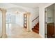 Spacious foyer featuring elegant columns, beautiful tile flooring, and a glimpse into adjoining rooms at 6212 N Grady Ave, Tampa, FL 33614
