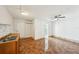 Kitchen with sink and cabinet, white door to exterior and door leading to the bathroom at 6212 N Grady Ave, Tampa, FL 33614