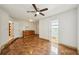 Kitchen with sink, access to exterior and bathroom, a ceiling fan, and brown tile flooring at 6212 N Grady Ave, Tampa, FL 33614