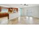 Open living space featuring tile flooring, bar counter and access to the outdoor area at 6212 N Grady Ave, Tampa, FL 33614