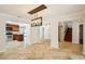Bright living room showcasing an open layout with a staircase, and view of kitchen at 6212 N Grady Ave, Tampa, FL 33614
