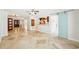 Spacious living room featuring tile flooring and open access to the kitchen at 6212 N Grady Ave, Tampa, FL 33614